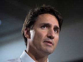 Liberal leader Justin Trudeau speaks to the media prior to a rally in Edmonton on Wednesday, Sept, 9, 2015.