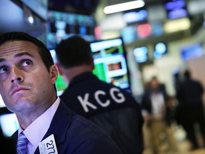 Traders work on the floor of the New York stock exchange.