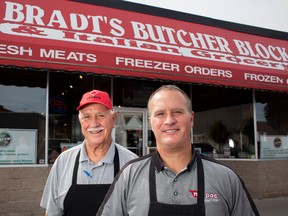 Scott Bradt, right, poses with his father Neil Bradt at his Leamington, Ont. butcher shop Bradt's Butcher Block.