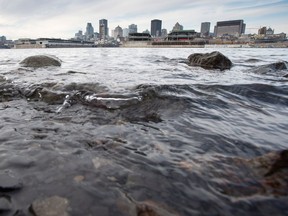 The waters of the St. Lawrence River flow past the city of Montreal.