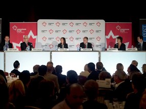 Canadian Club Toronto moderator Bruce Sellery (LEFT) speaks as participants (FROM SECOND LEFT TO RIGHT) Terrence Corcoran, Amanda Lang, Warren Jestin, Diane Francis and Andrew Coyne look on during the 39th Annual Outlook 2016 event.