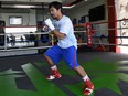 This photo taken on February 15, 2016 shows Philippine boxing icon Manny Pacquiao wearing shorts and shoes with Nike logos during his training session at a gym in General Santos on the southern Philippine island of Mindanao. US sports equipment giant Nike on February 17 axed Manny Pacquiao after he described gay couples as "worse than animals", slamming the Filipino boxer's remarks as "abhorrent."      AFP PHOTO / TED ALJIBETED ALJIBE/AFP/Getty Images