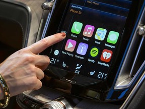 Apple's CarPlay touch-screen is shown inside a Volvo Estate concept car.