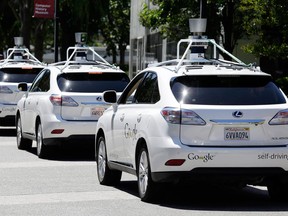 A row of Google self-driving Lexus cars in 2014.