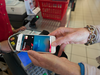 Jennifer Bailey, Vice President of Apple Pay, shows how to use Apple Pay using her iPhone at the Canadian Tire at Lakeshore and Leslie in Toronto.