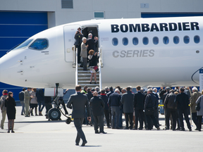 Bombardier shareholders take a tour of a Bombardier CSeries 300 following the company's annual general meeting