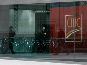 People walk inside the CIBC building in downtown Toronto.