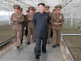 This undated picture shows North Korean leader Kim Jong-Un, centre.