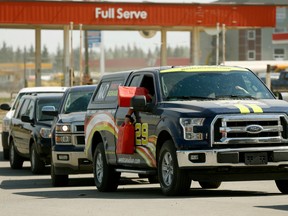 Evacuees from Fort McMurray line up for gas at Grassland, Alberta after fleeing an out of control wildfire that has forced the evacuation of Fort McMurray, Alberta.