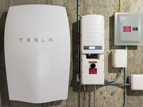 A Tesla Motors Inc. Powerwall unit sits inside a home