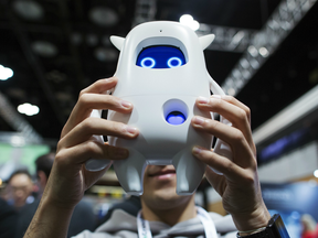 An exhibitor displays Musio, a deep learning based artificial intelligence robot manufactured by AKA Study Limited, during the TechCrunch Disrupt conference