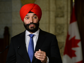 Navdeep Bains, Minister of Innovation, Science and Economic Development, speaks to media in the foyer of the House of Commons on Parliament Hill.