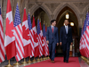 Prime Minister Justin Trudeau, left, and U.S. President Barack Obama, speak as they walk inside Parliament Hill in Ottawa.