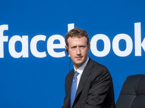 Mark Zuckerberg, chief executive officer of Facebook Inc., listens during a town hall meeting at Facebook headquarters in Menlo Park, California, U.S.