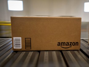 Boxes move along a conveyor belt at the Amazon.com Inc. fulfillment centre