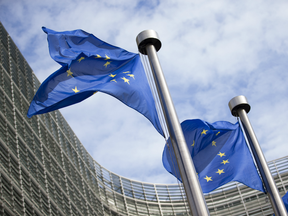 Flags of the European Union (EU) fly outside the European Commission building in Brussels, Belgium.