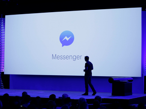 David Marcus, Facebook Vice President of Messaging Products, watches a display showing new features of Messenger during a keynote address