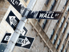 A Wall Street sign hangs near the New York Stock Exchange