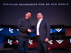 LeEco CEO YT Jia, left, and VIZIO CEO William Wang, right, shake hands at the LeEco and VIZIO Press Conference in Hollywood