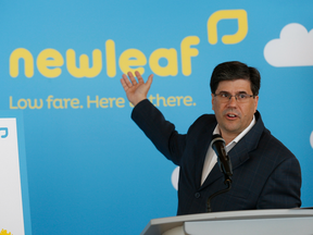 Jim Young, President and CEO of NewLeaf Travel, speaks to media at a press conference