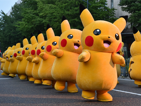 Performers dressed as Pikachu, the popular Pokemon character, at the Yokohama Dance Parade in Yokohama.