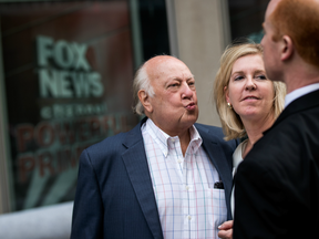 Fox News chairman Roger Ailes walks with his wife Elizabeth Tilson as they leave the News Corp building