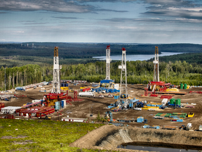 Rigs on a drilling pad from Seven Generations Energy's Montney operations 100 kilometres south of Grande Prairie, Alberta.