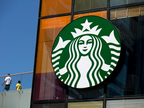 The Starbucks Corp. logo is displayed outside one of the company's coffee shops in Beijing, China.