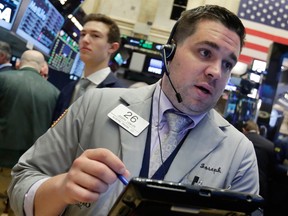 TSX slumped and Wall Street opened lower today as investors braced for another set of corporate earnings and awaited the Federal Reserve’s monetary policy meeting.