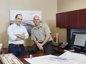 Denison Mines President & CEO, David Cates (left) and VP Project Development, Peter Longo, reviewing the company’s development plans for the Wheeler River project from their office in Saskatoon, SK.