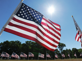 Hundreds of American flags fly at the entrance to the Southwest Michigan Regional Airport