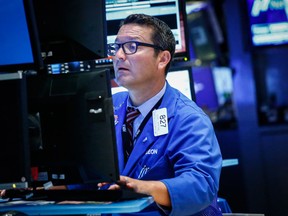 A trader works on the floor of the New York Stock Exchange.