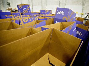 Empty boxes sit in stacks at a Jet.com Inc. fulfillment centre. Wal-Mart Stores Inc. agreed to buy e-commerce startup Jet.com Inc. for about US$3 billion in cash.