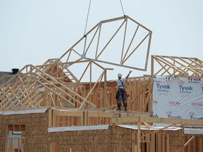 Canada Mortgage and Housing Corp. says the seasonally adjusted rate of housing starts in July was 198,395 units, down from 218,326 units the month before.