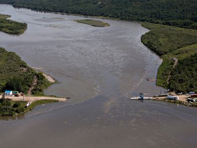 Crews work to clean up an oil spill on the North Saskatchewan River.