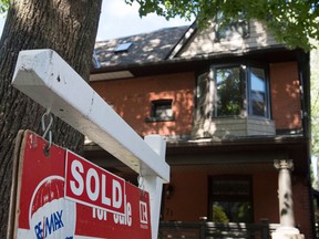 The Canadian Real Estate Association says July marked the third consecutive month of fewer housing sales.