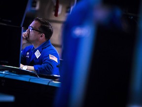 A trader works on the floor of the New York Stock Exchange.