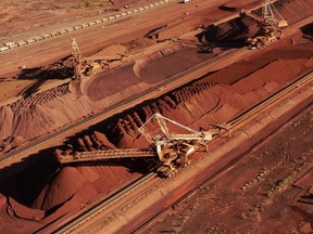BHP Billiton was hammered by a bad bet on shale, a dam disaster in Brazil and a commodities slump this quarter, but sounded a note of optimism as prices stabilize and its costs fall.