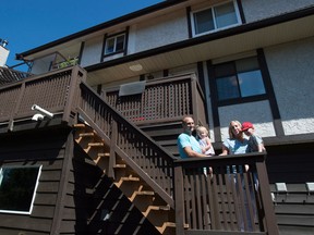 Heather Nyberg along with husband Dan Zimmermann and son Leo and daughter Isabel pose for a photo outside their home in Coquitlam, B.C.