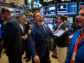 Traders work on the floor of the New York Stock Exchange.