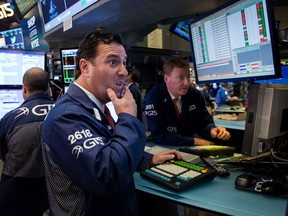 Traders work on the floor of the New York Stock Exchange.