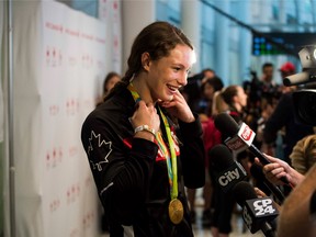 Canadian multi-medallist  Penny Oleksiak speaks to media as she is welcomed at the Toronto Pearson Airport in Toronto