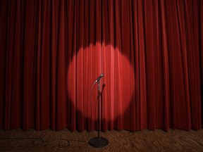 Spotlight on microphone stand on stage