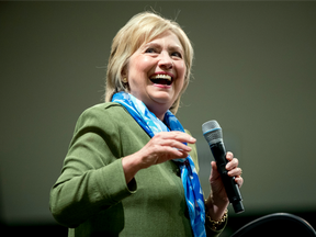 Democratic presidential candidate Hillary Clinton pauses while speaking at a rally at Adams City High School in Commerce City, Colo