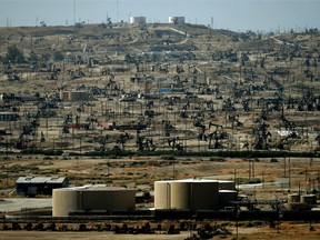 A general view shows oil pumping jacks and drilling pads at the Kern River Oil Field where the principle operator is the Chevron Corporation in Bakersfield, California