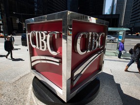 CIBC profit rose nearly 50 per cent from a year ago to $1.44 billion, partly due to the sale of its minority investment in American Century Investments.