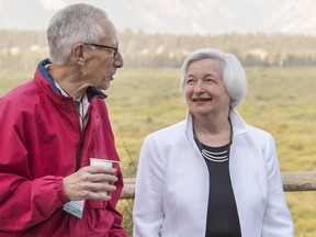 Stanley Fischer, vice chairman of the U.S. Federal Reserve, left, and Janet Yellen, chair of the U.S. Federal Reserve, right, speak outside of the Jackson Lake Lodge during the Jackson Hole economic symposium.