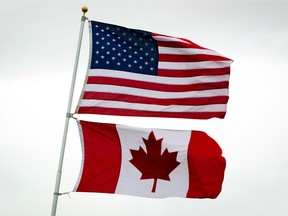 U.S. and Canadian flags fly in Point Roberts, Wash.