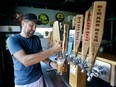 Joe Winiarski owner of a small farm and brewery in Wildwood, Fla. pours a beer from one of the many selections that his brewery offers. Winiarski is recognized as the first commercial hops grower in Florida.