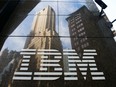 The International Business Machines Corp. (IBM) logo is displayed in front of the company's offices in New York